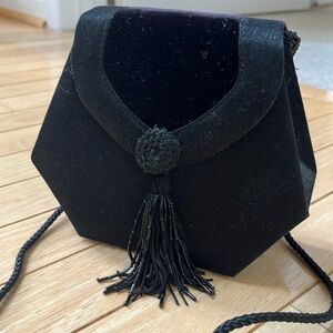 Black tasseled evening bag
